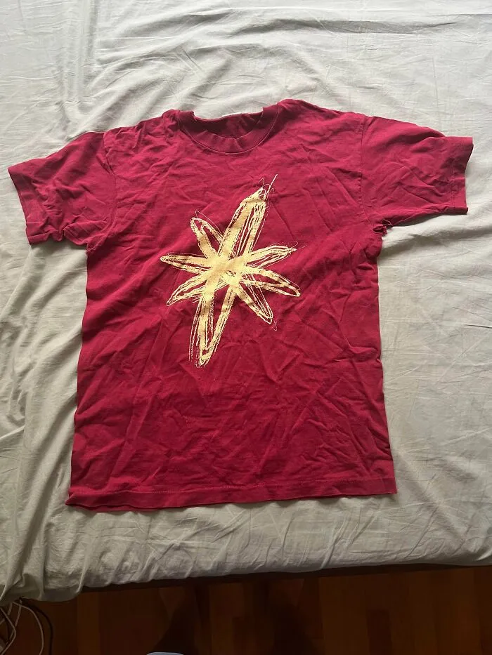 Red t-shirt with yellow star design linked to Gen X childhood nostalgia
