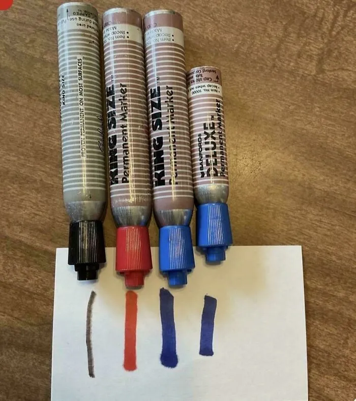 Old Sanford Deluxe permanent markers with color swatches on paper
