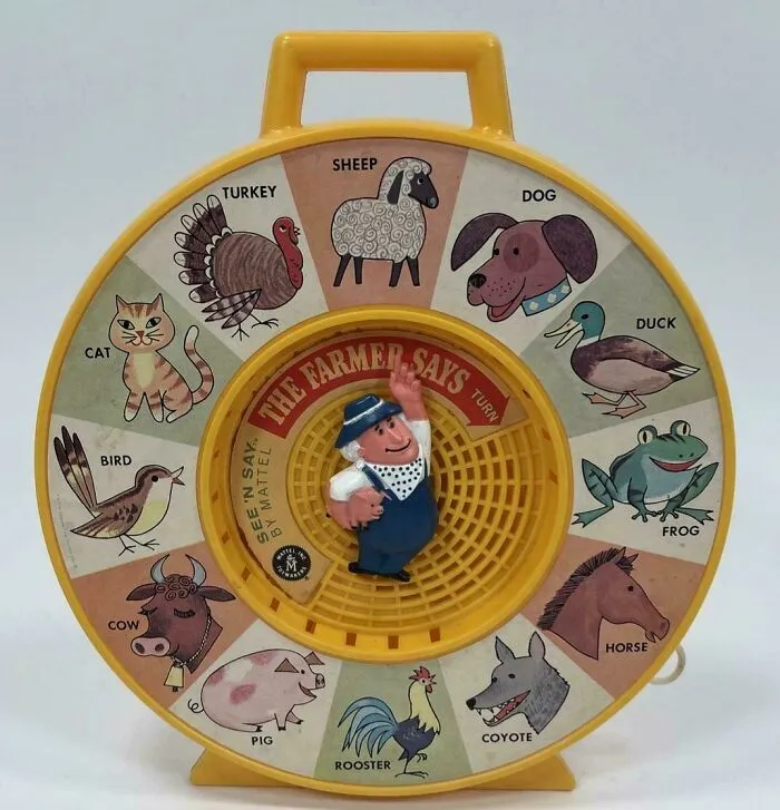 Vintage farm animal sound toy with spinning farmer figure for Gen X childhood memory