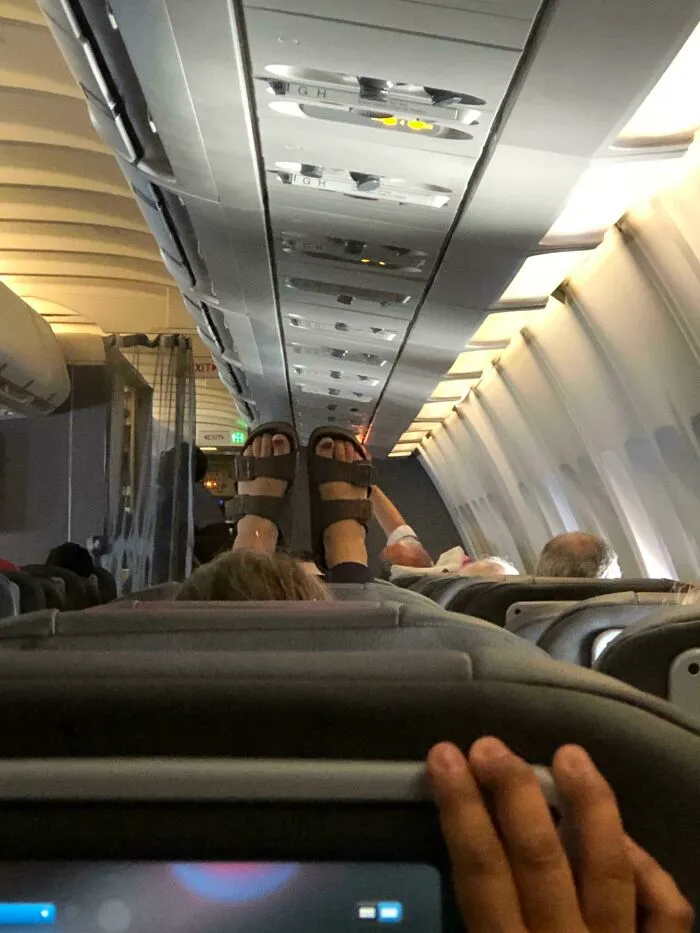 For Today’s In Flight Entertainment, This Women’s Sweaty Feet!