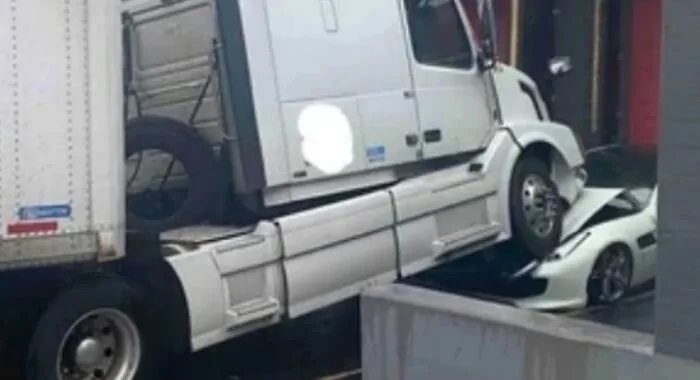 Company Owner Decided To Stop Paying His Drivers So One Of Them Parked Their Semi On The Owner's Ferrari And Just Left It