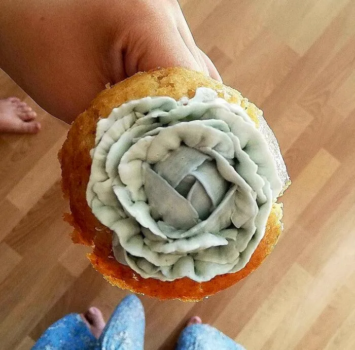 Moldy or poorly decorated cupcake showcasing a cooking fail