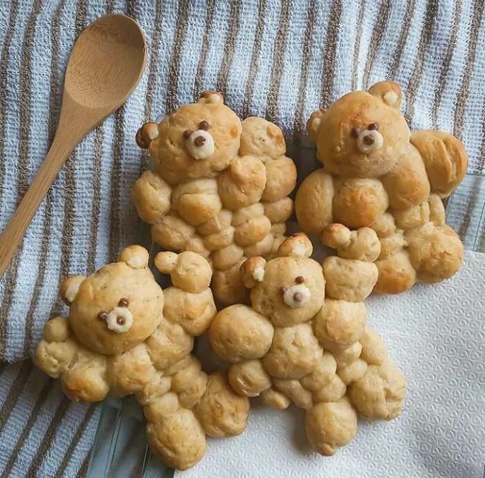 Baked bear-shaped bread rolls that showcase cooking attempts gone wrong