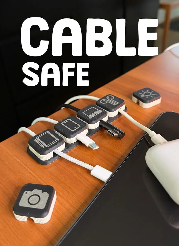3D printed cable organizer labeled with device icons for safe cable management