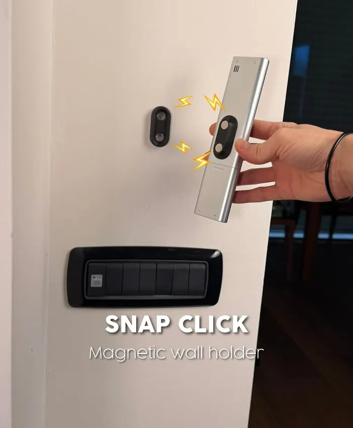 3D printed magnetic wall holder snapping a remote control on wall