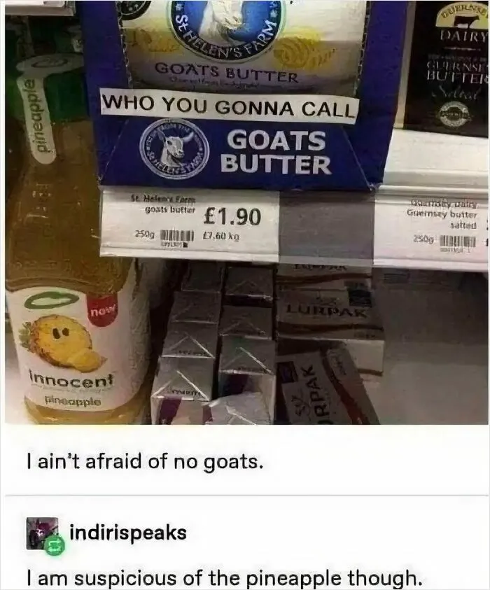 Funny grocery shelf sign saying who you gonna call goats butter with a pineapple drink nearby