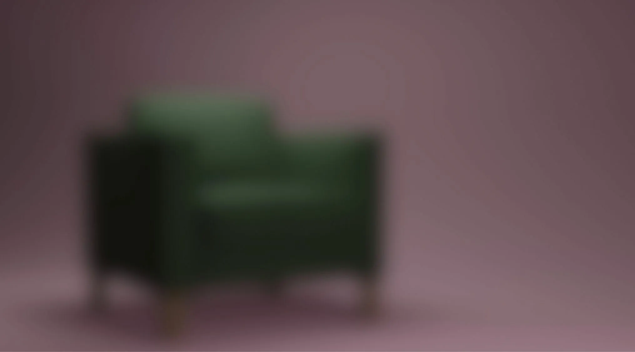 Blurry image of a green armchair