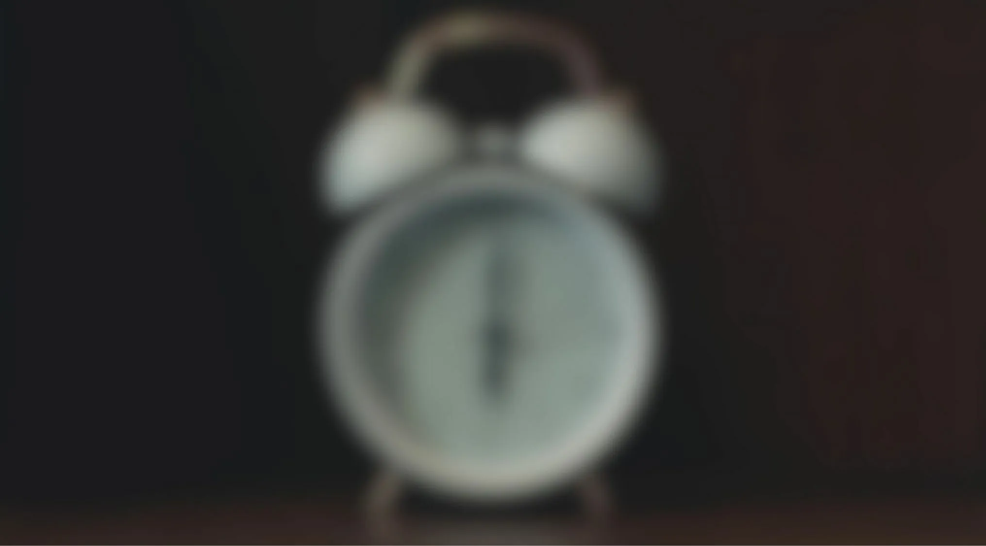 Blurry image of an alarm clock in darkness eyesight trivia quiz