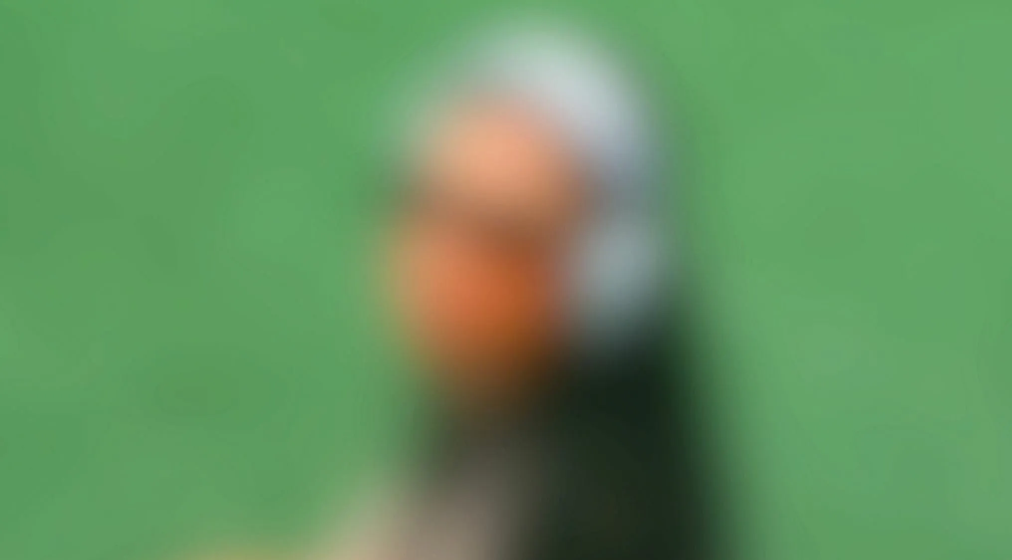 Blurry image of a woman using an electronic device