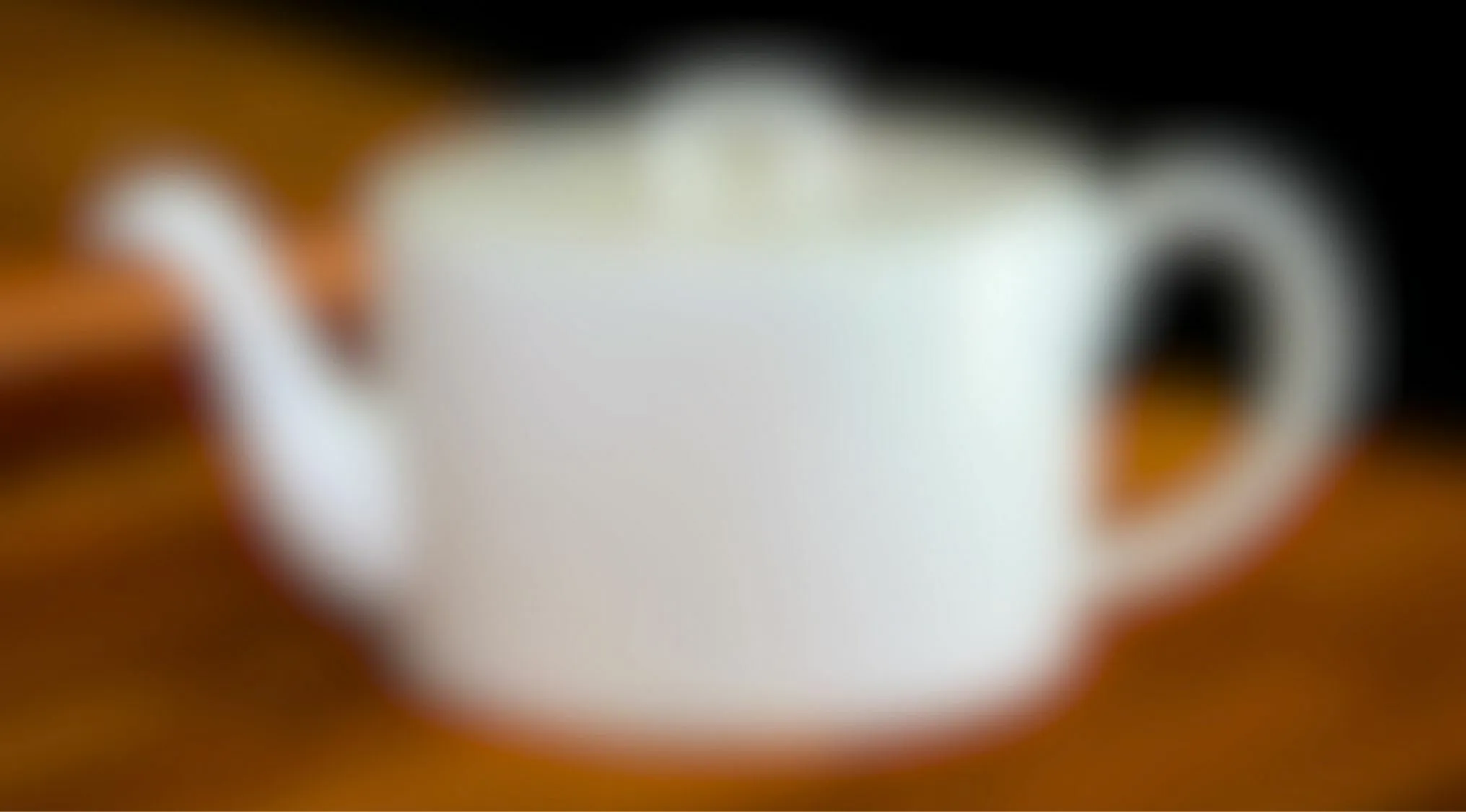 Blurry white teapot on wooden table eyesight trivia quiz