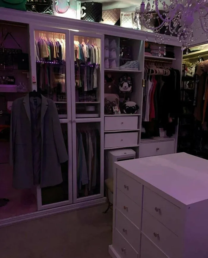 An organized walk-in closet with custom shelving and LED lighting, perfect for DIY home upgrades.