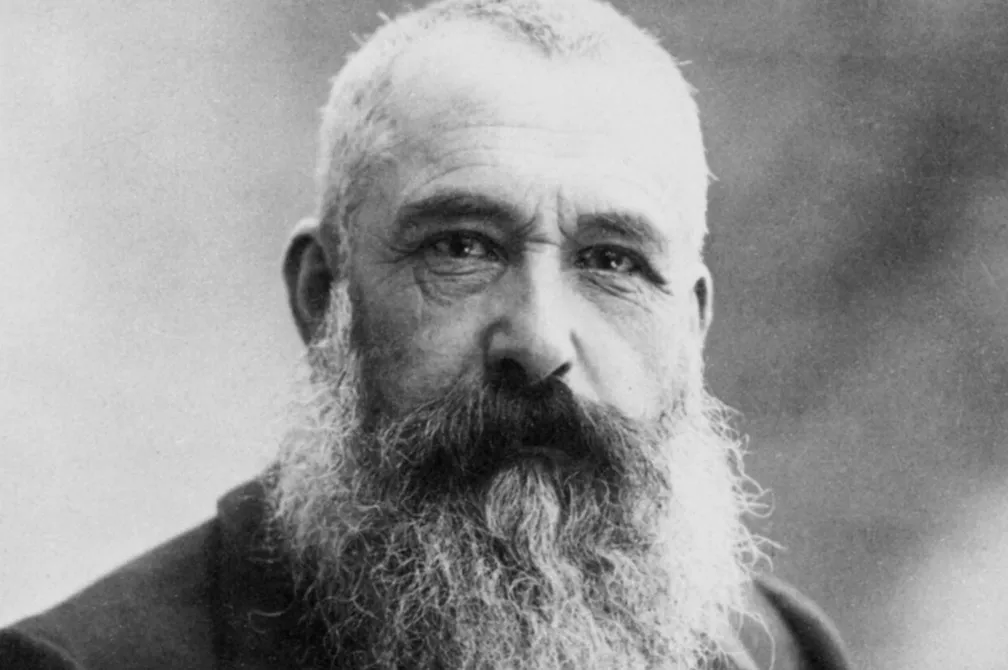 Vintage black and white portrait of artist Claude Monet with a long beard