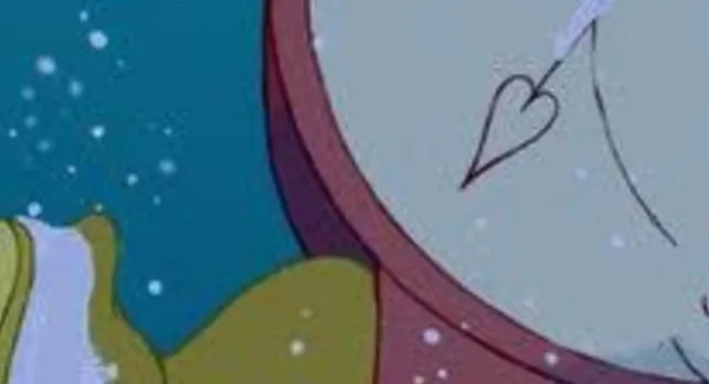 An extreme zoom-in of a Disney character holding a pocket watch with a heart-shaped hand in a snowy setting.