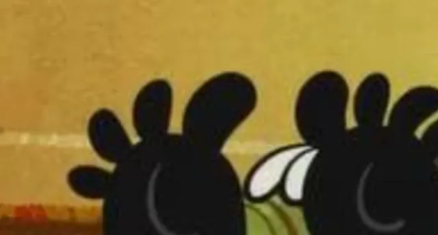An extreme zoom-in of black cartoon feet, challenging players to guess the Disney character.