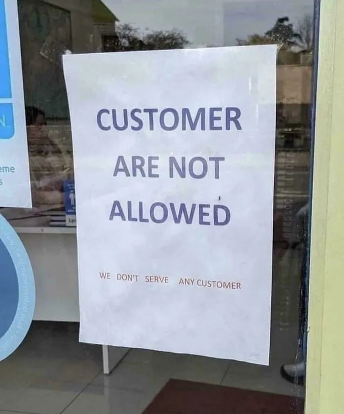 Funny sign stating customers are not allowed and no customers served
