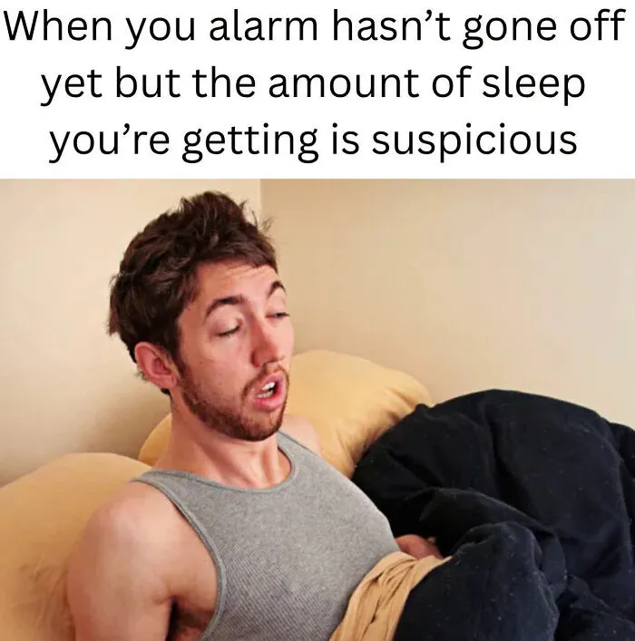Sleepy man suspicious about amount of sleep before alarm on workday