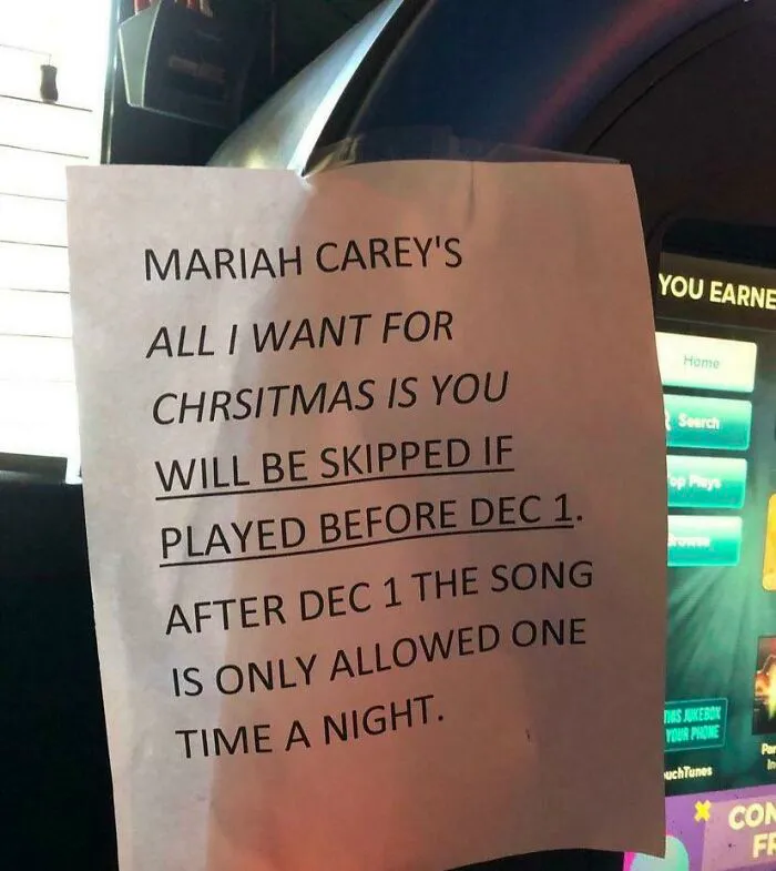 Sign humorously skipping Mariah Carey's Christmas song before December 1