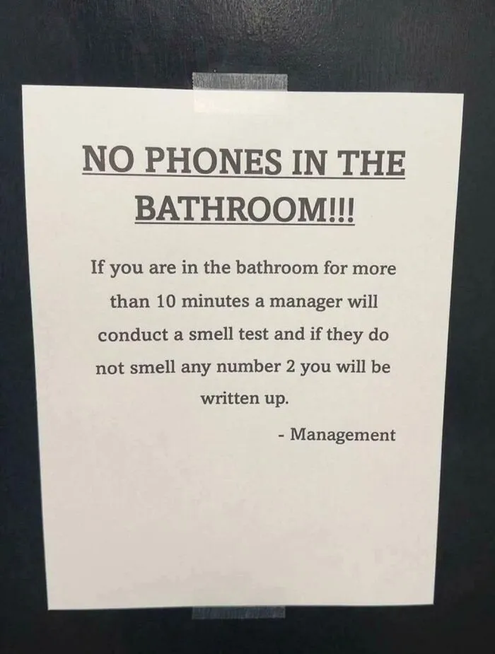 No phones in bathroom sign warns of smell test for lingering too long