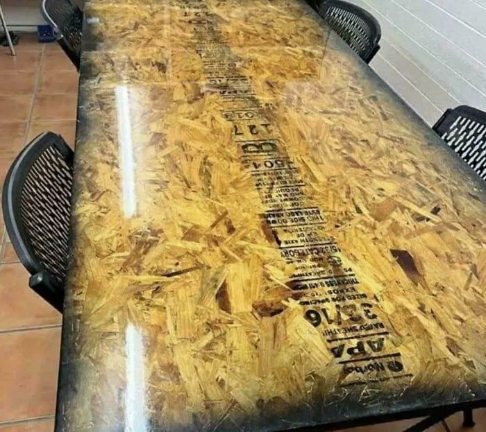 A dining table with a top made from cheap OSB wood in houses