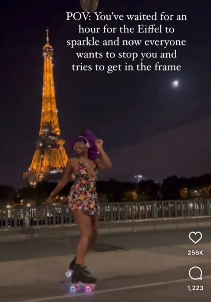 A skater films a video in front of the Eiffel Tower, acting like she has main character lives.