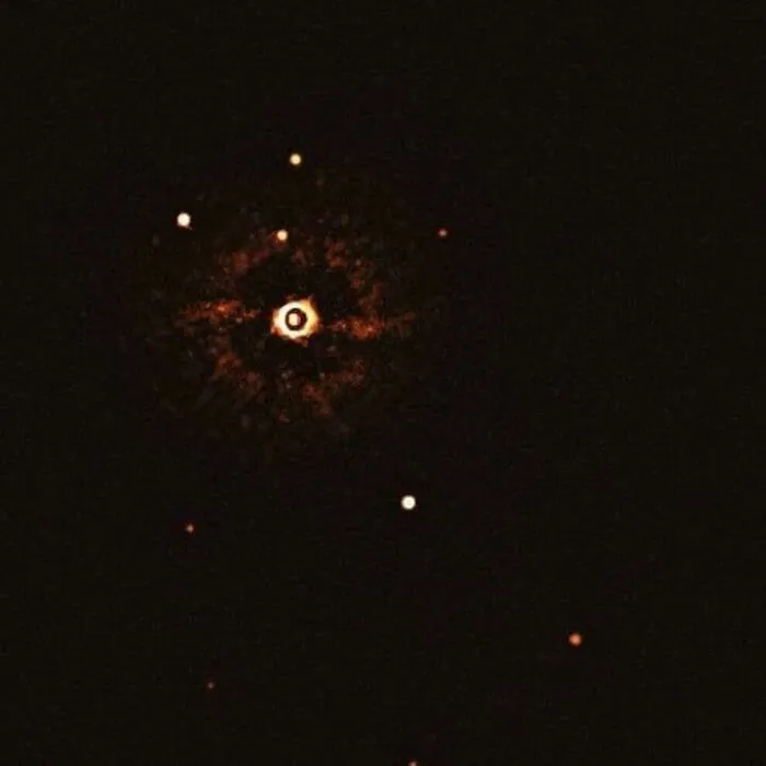 Interesting and cool photos showing a direct image of another solar system with a star and planets
