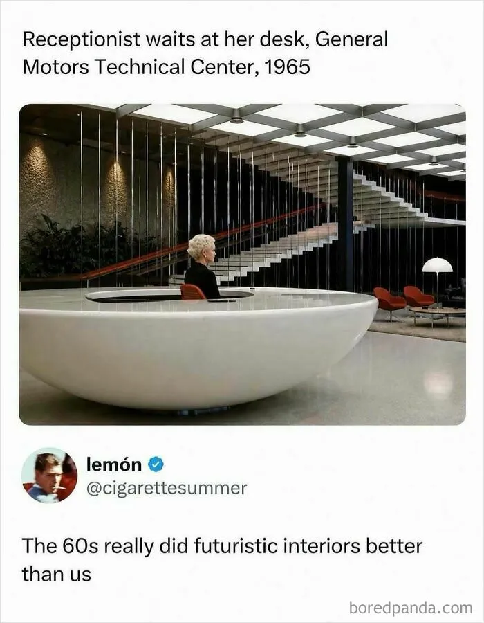 Receptionist sitting in a futuristic 1960s General Motors Technical Center lobby