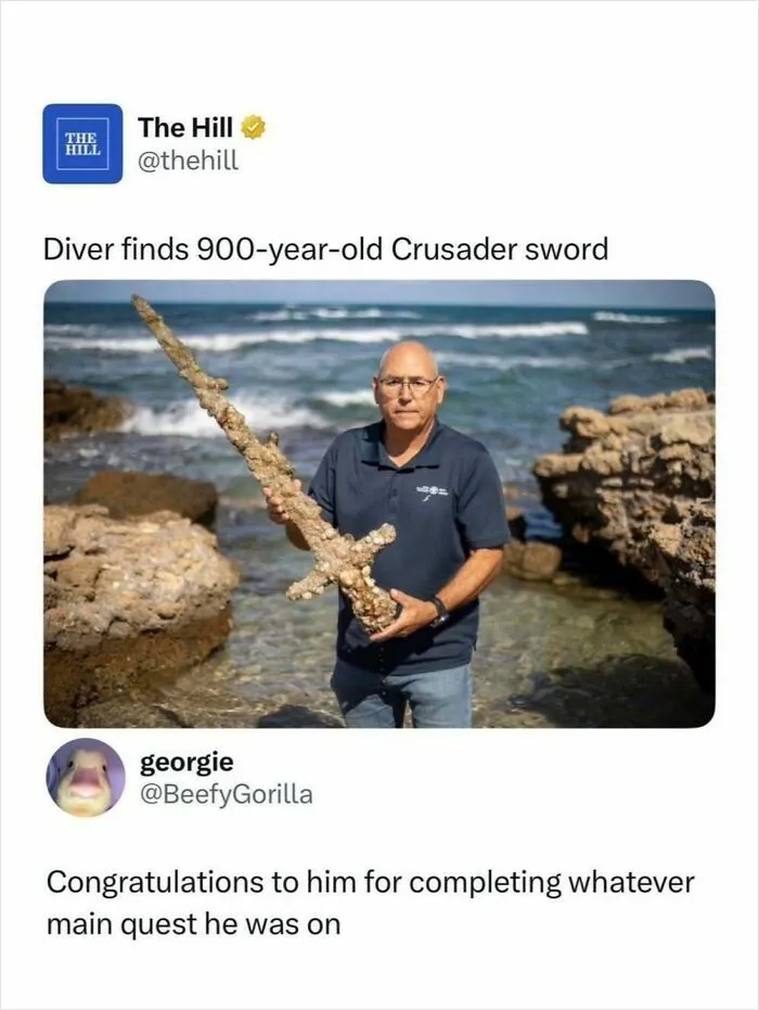 Diver holds 900-year-old Crusader sword found underwater near rocky shore