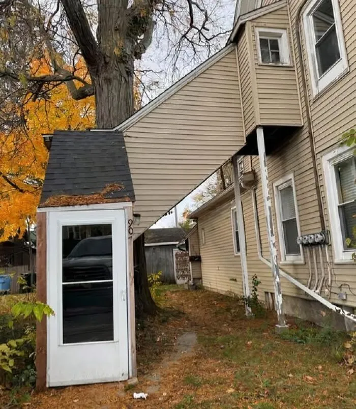 A poorly designed house extension linking a front entryway over a gap