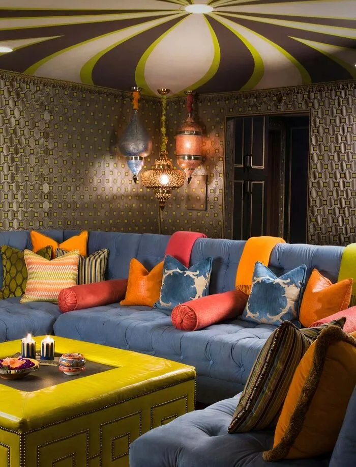 Vibrant bohemian living room with colorful patterned decor, showcasing eccentric houses interior designs.