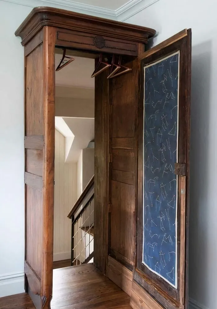A wardrobe closet that opens directly into a staircase, illustrating highly unusual house layout designs.