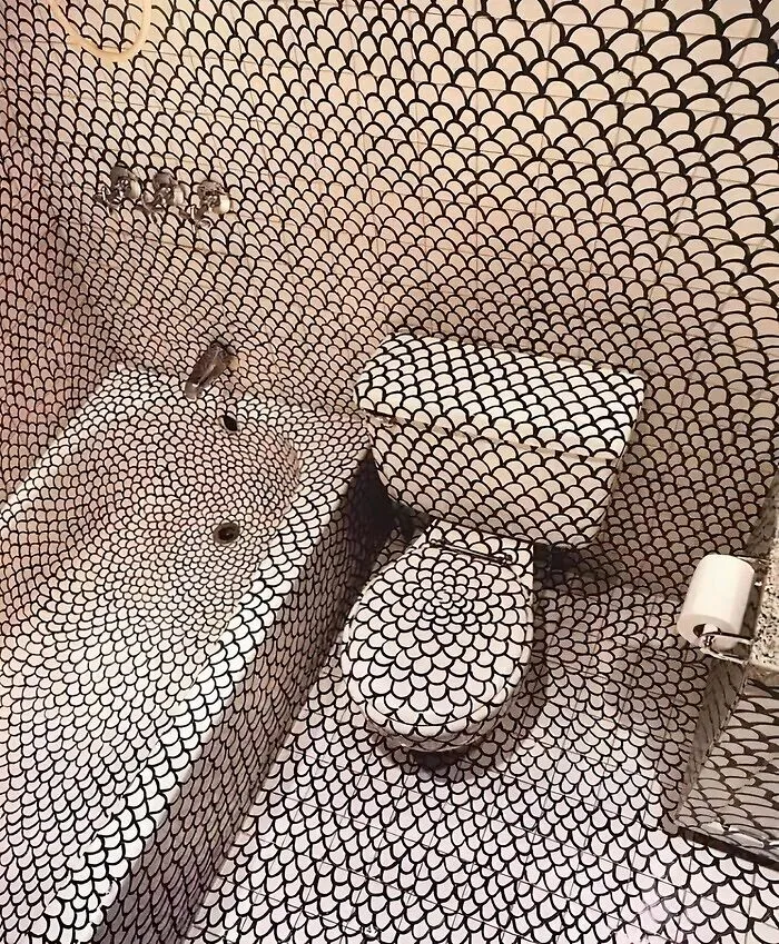 Dizzying black and white patterned tile in bathroom houses design fail.