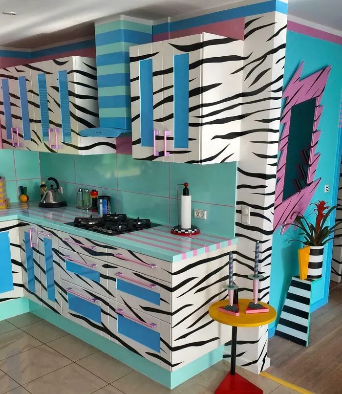 A brightly colored kitchen featuring zebra stripe patterns, blue accents, and a bold vision design