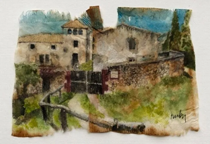A delicate miniature painting of old European stone houses on a torn used tea bag by Ruby Silvious