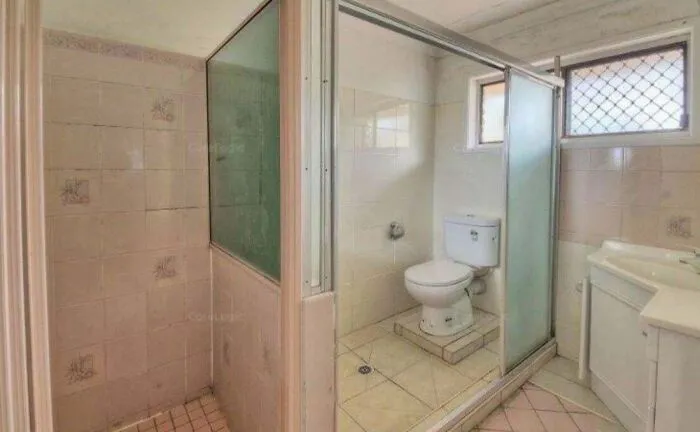 Extremely narrow bathroom layout highlighting poor renting and booking accommodation choices