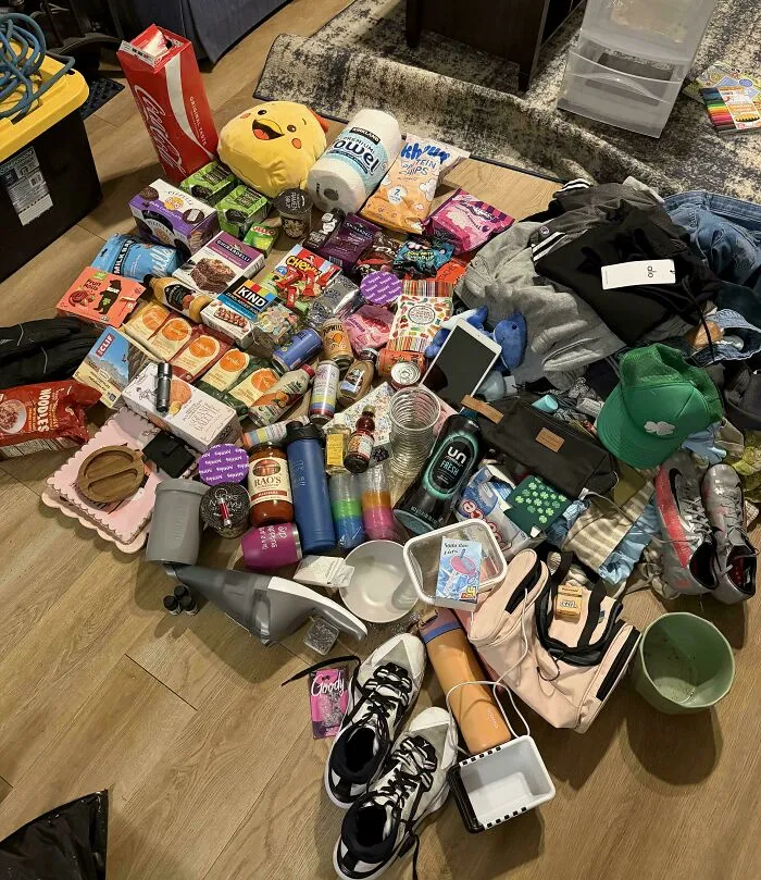 Assorted household items including snacks and clothes from dumpster diving finds