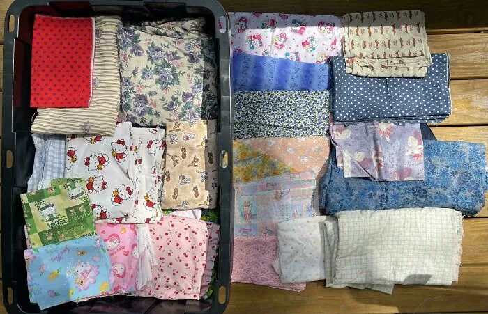 Assorted fabrics and textiles found in dumpster diving haul