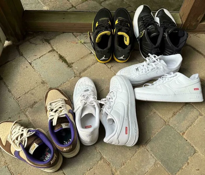 Various sneakers including white Supreme Nike shoes dumpster diving find