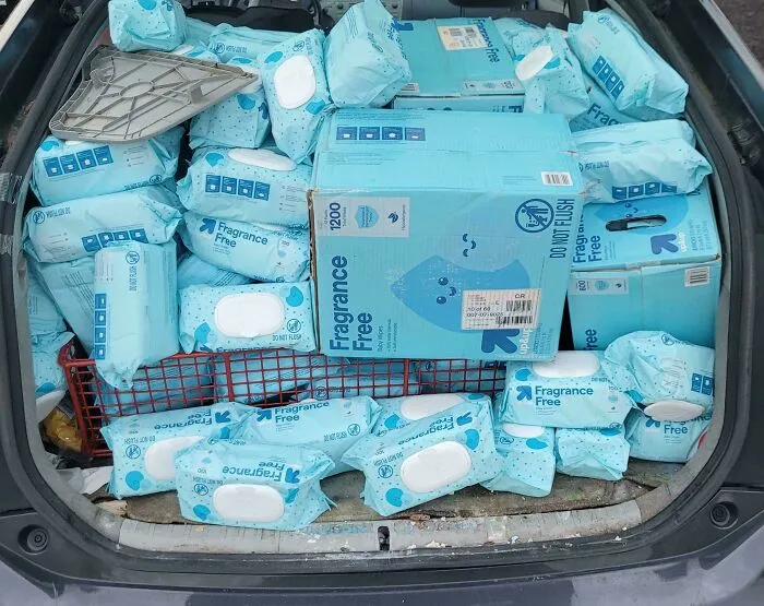 Car trunk full of fragrance free wet wipes dumpster diving find