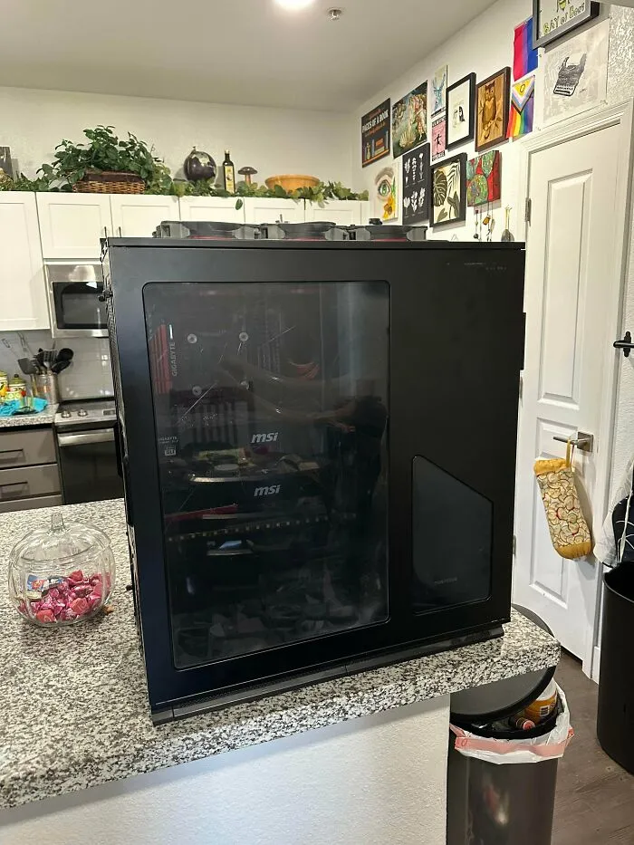 Gaming computer tower rescued from dumpster in kitchen setting