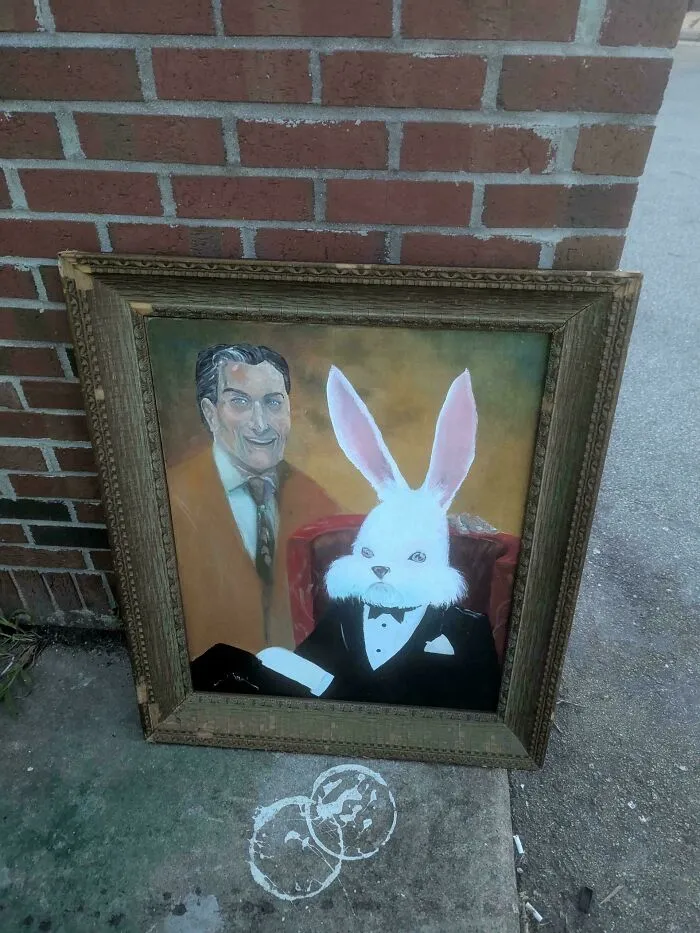 Framed painting of man and rabbit in tuxedo found while dumpster diving