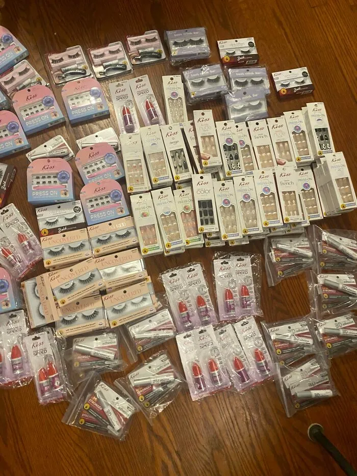 Assorted beauty products including eyelashes and nail sets found in dumpster diving