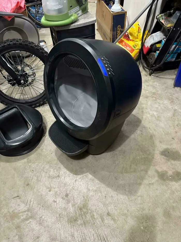 Modern pet litter box retrieved from dumpster diving