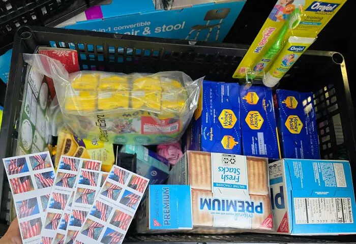 Box filled with snacks and household items found in dumpster diving haul