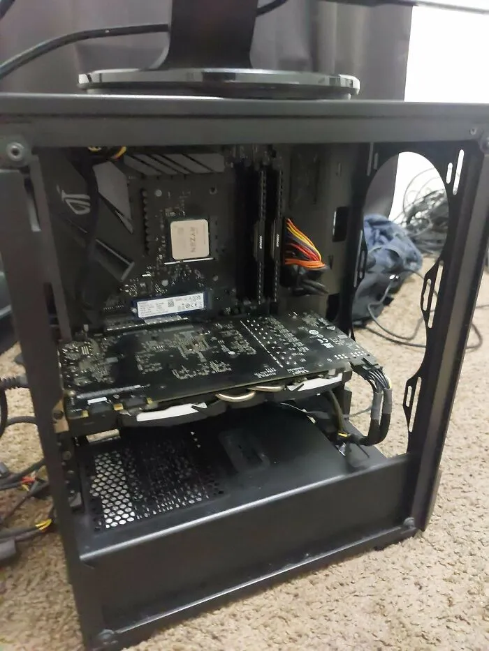 Open computer case showing internal components from dumpster diving finds