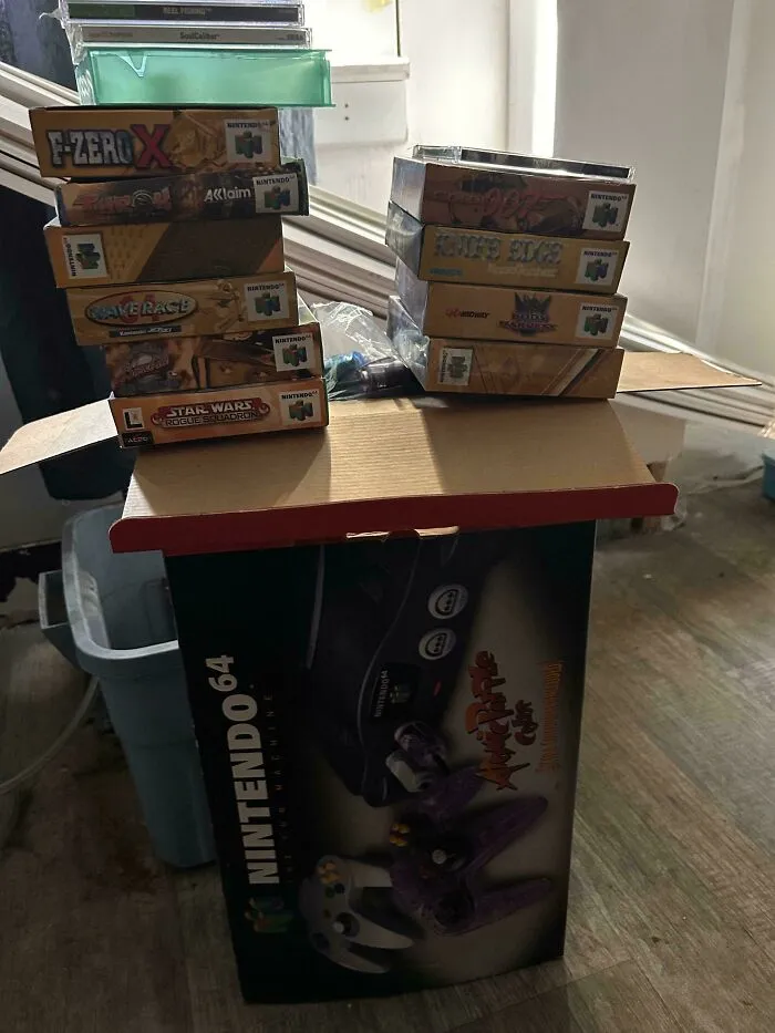 Nintendo 64 console and game cartridges found dumpster diving indoors