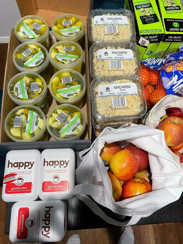 Box of groceries including apples and macaroni salad found dumpster diving