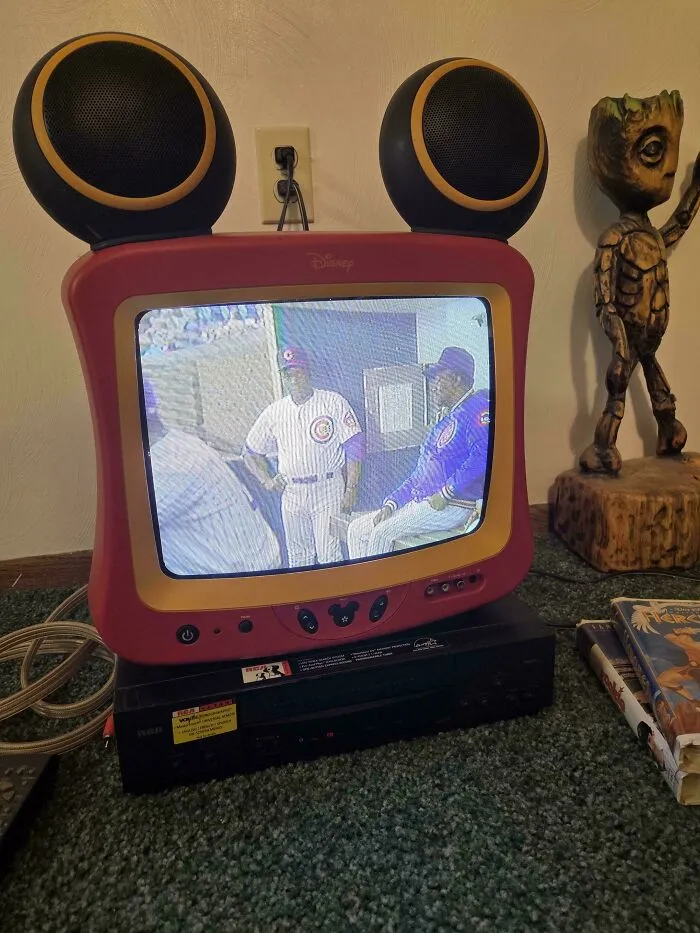 Disney TV with Mickey Mouse ears and Groot figure found dumpster diving