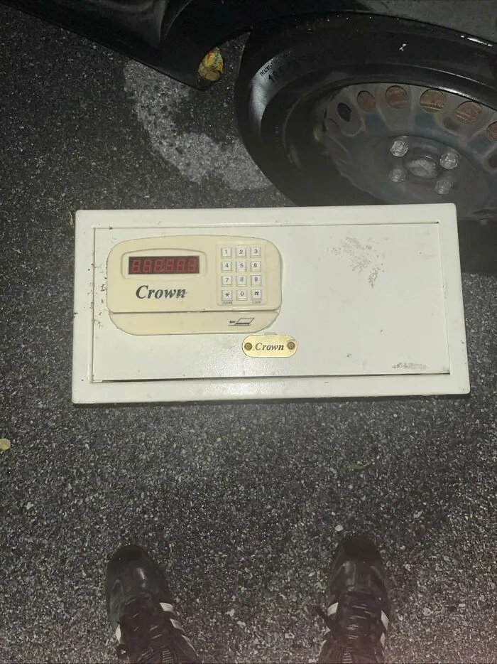 Digital Crown safe found while dumpster diving on asphalt next to car wheel
