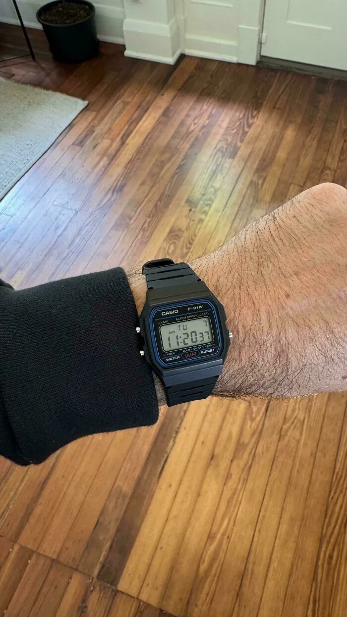 Classic black Casio F-91W digital watch worn on a wrist, representing old products built to last.