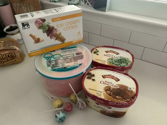 A pile of ice cream tubs and cones showing a silly thing wives do